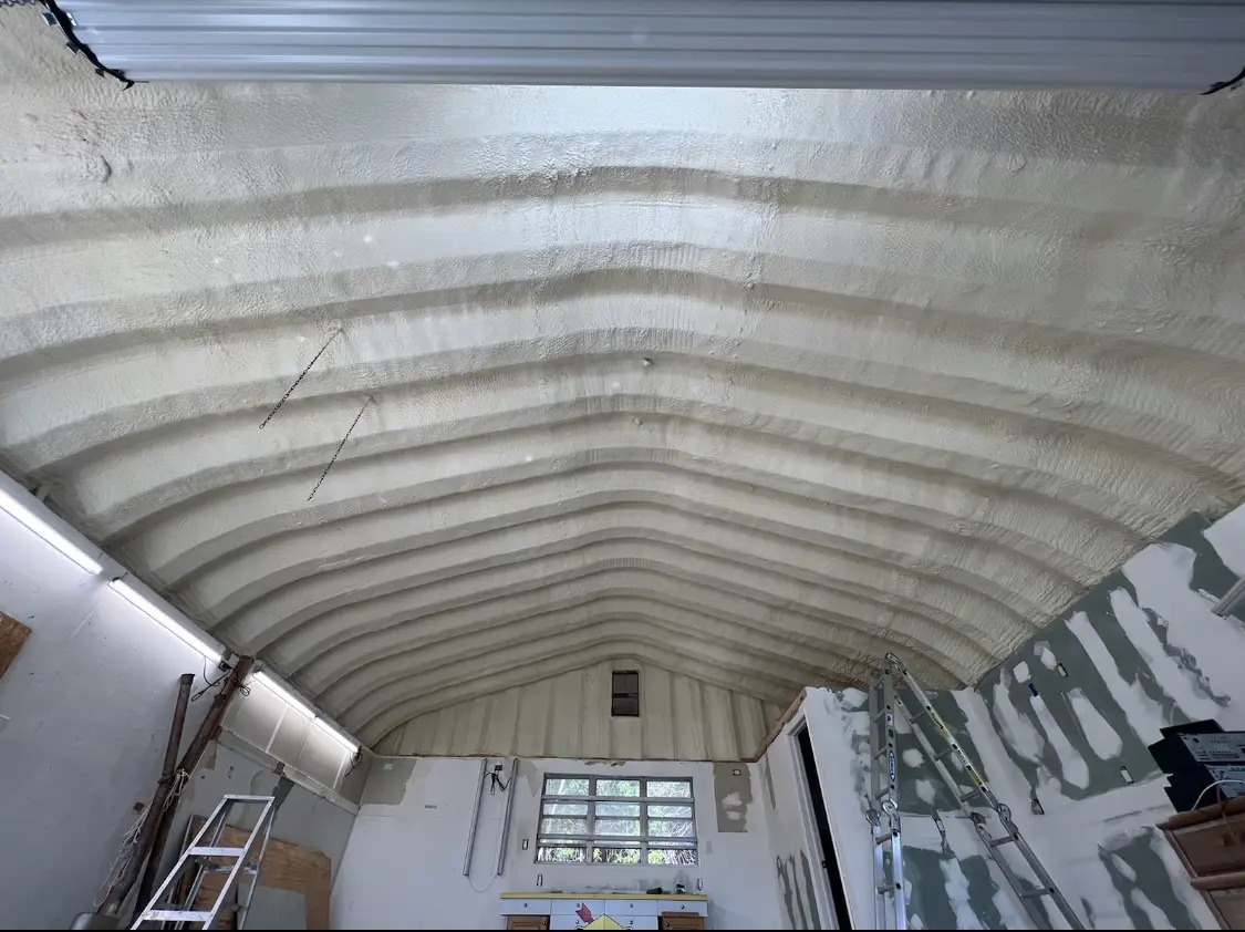 Spray polyurethane foam applied to the underside of a metal roof deck in Duanesburg